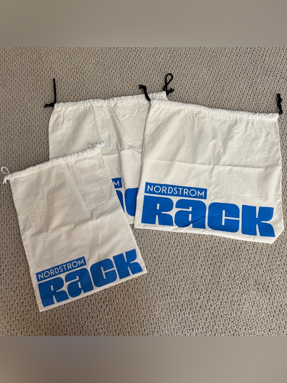 Nordstrom Rack White Drawstring Bags with Blue Logo